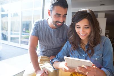 Couple on tablet | Veneers in chelsea heights
