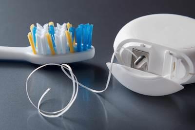 toothbrush and floss | chelsea heights dentist