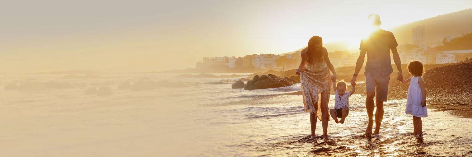 family on beach | dental clinic chelsea heights